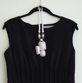 Black Dress with Pale Pink Necklace